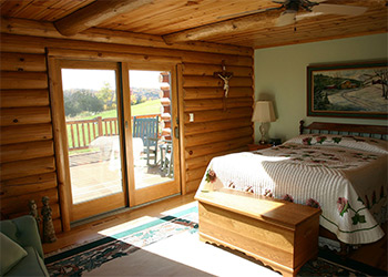 A 2 bedroom cabin with queen bed and 2 singles in the second bedroom