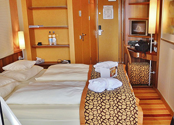 A 2 bedroom cabin with queen bed plus another bedroom with 2 single beds and spa bath